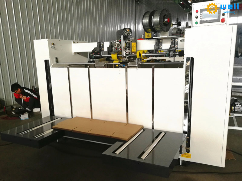 Semi-automatic carton box stitching machine